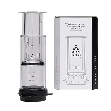 Danes Coffee Roasters Delter Coffee Press brewing equipment with stainless steel and plastic components for fresh coffee brewing.